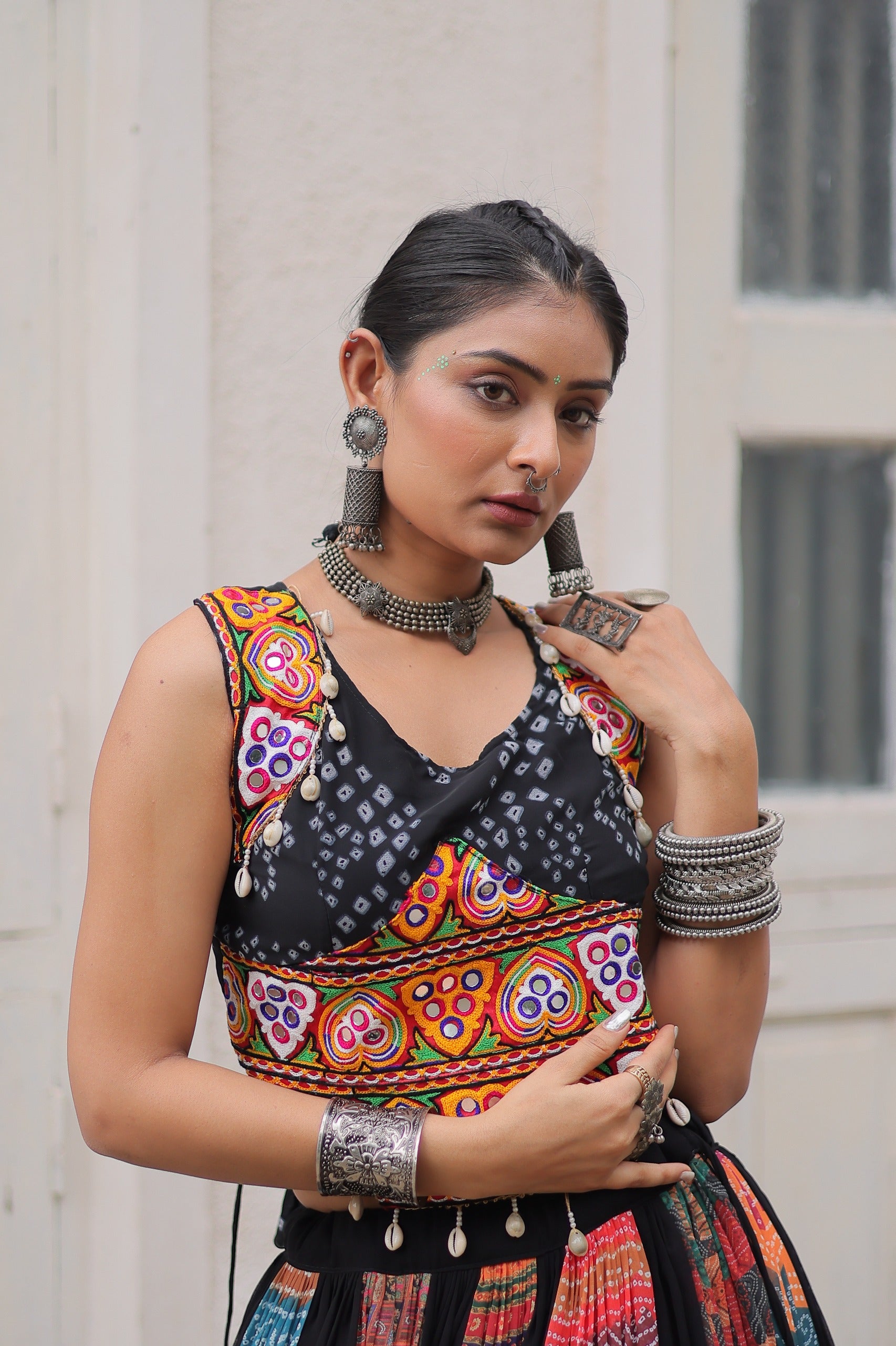 Black & Multi-Color Navratri Ghagra Choli with Embroidery and Traditional Patchwork  Description: