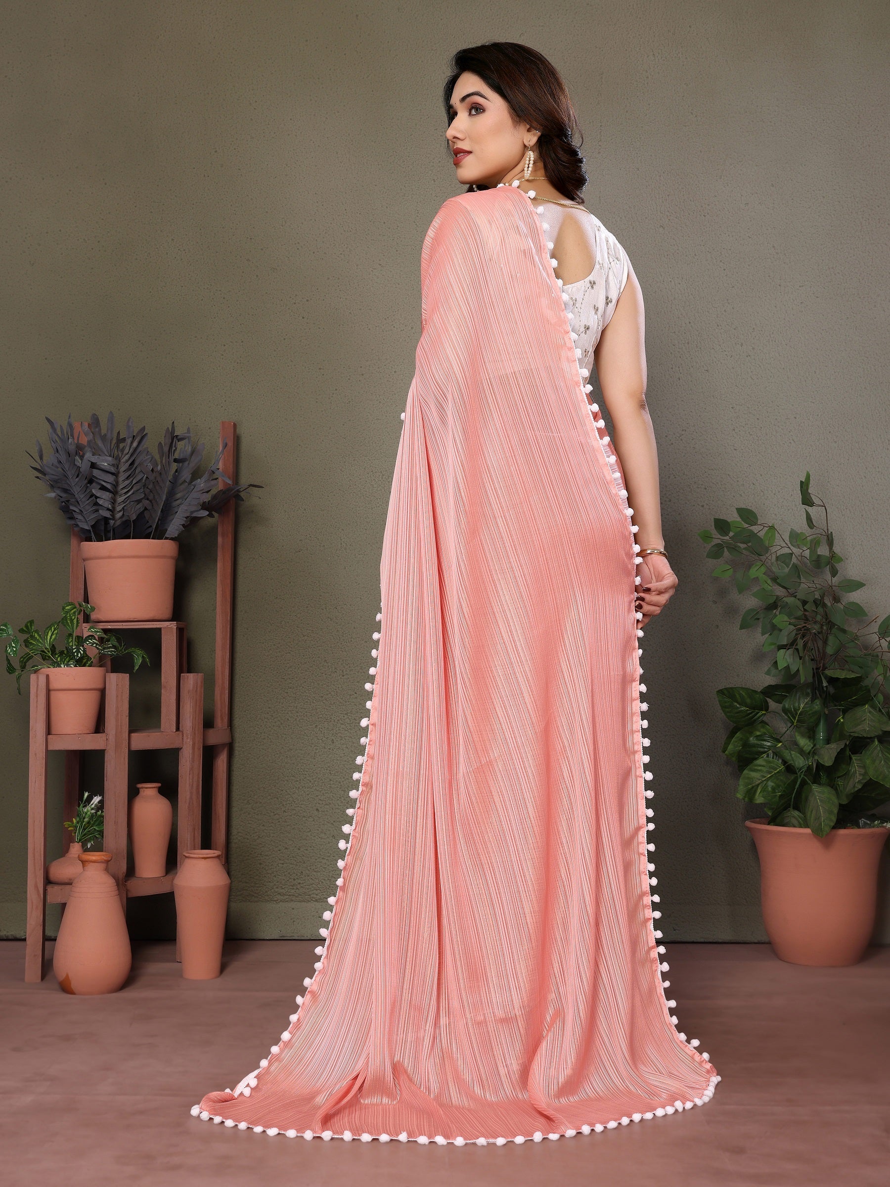 Elegant Peach Pleated Saree with Pom-Pom Border