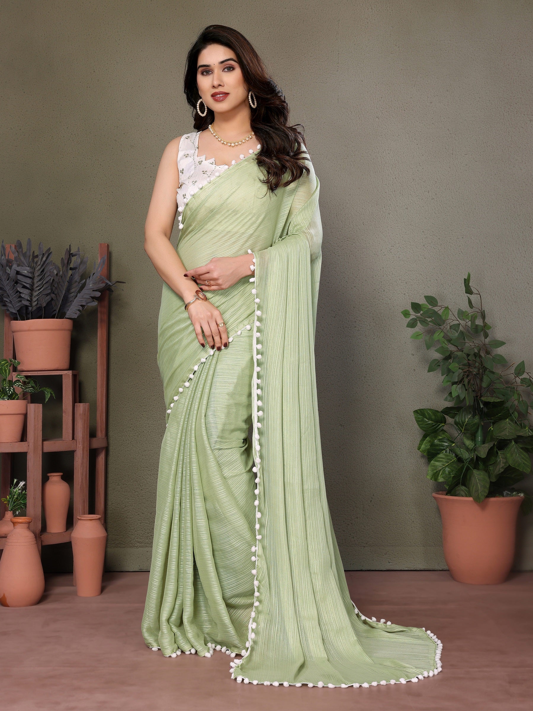 Elegant Light Green Pleated Saree with Pom-Pom Border