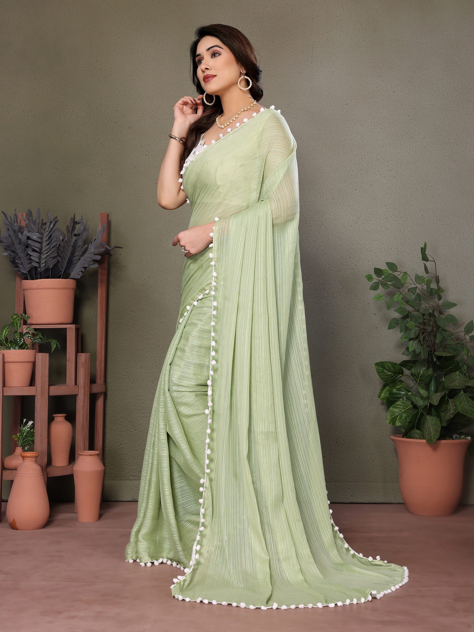 Elegant Light Green Pleated Saree with Pom-Pom Border