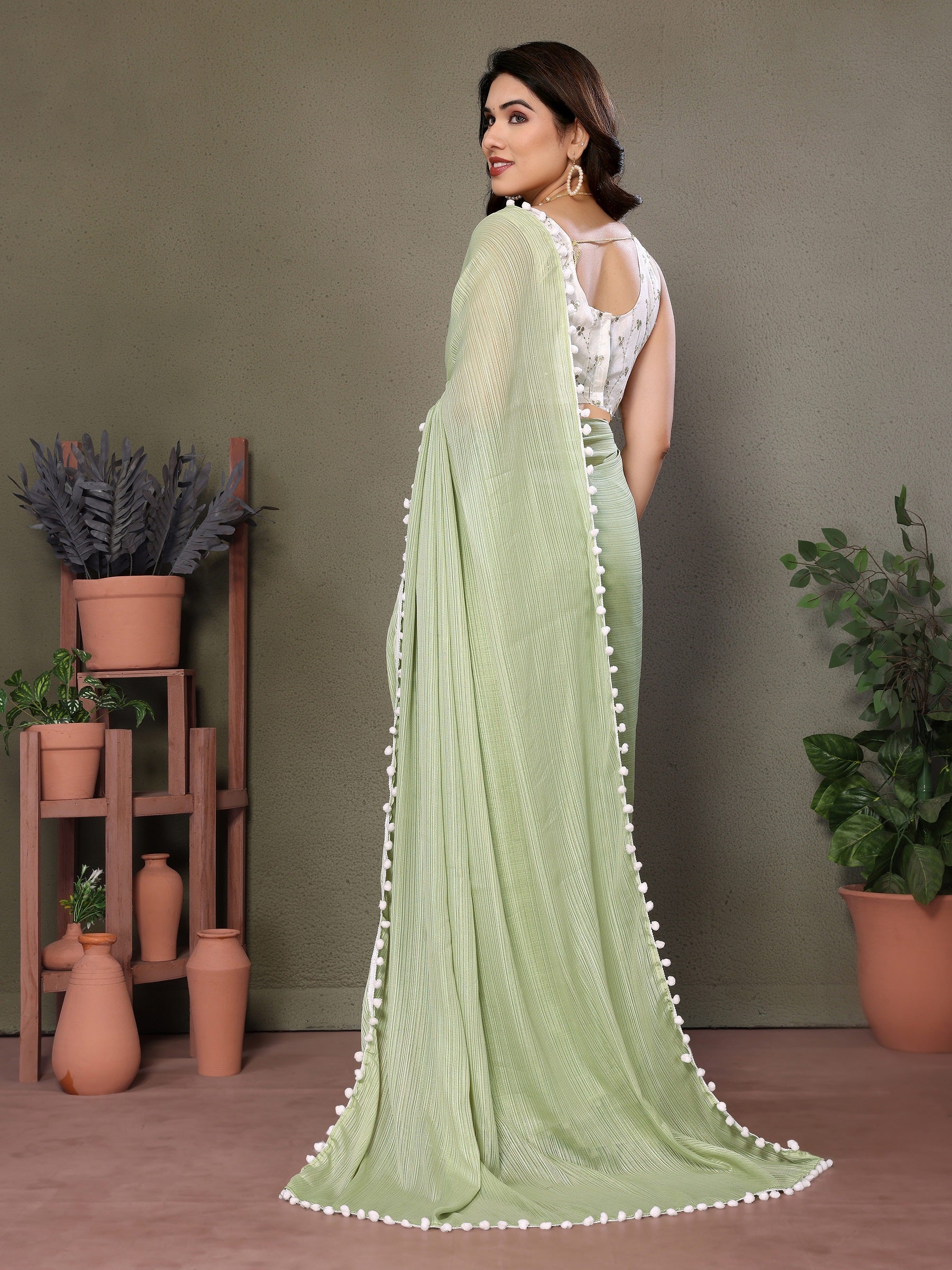 Elegant Light Green Pleated Saree with Pom-Pom Border