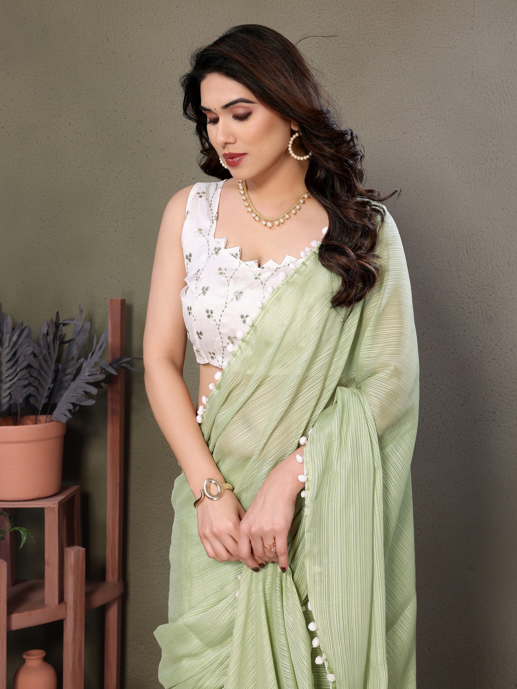 Elegant Light Green Pleated Saree with Pom-Pom Border