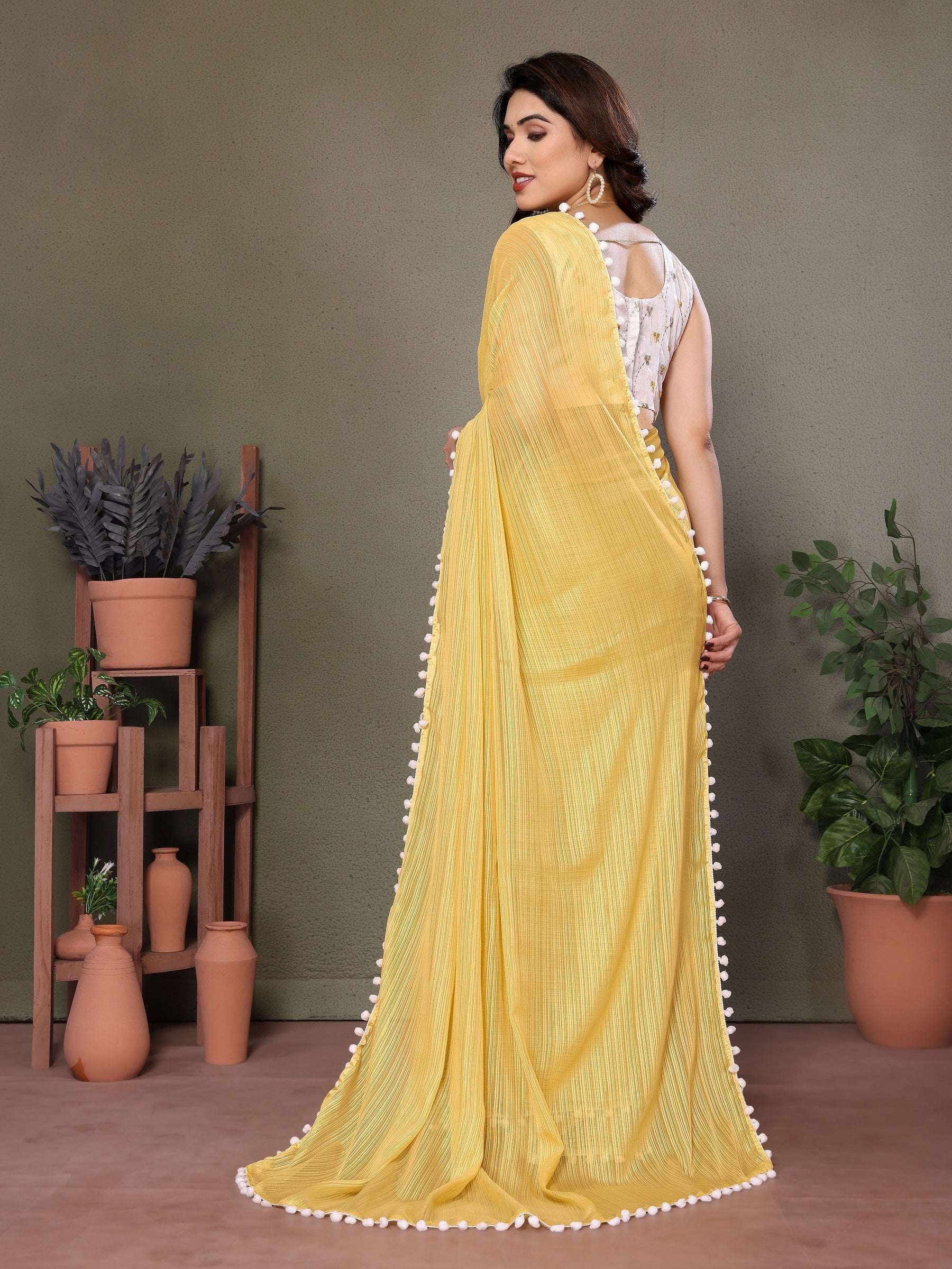 Sunny Yellow Pleated Saree with White Pom-Pom Border