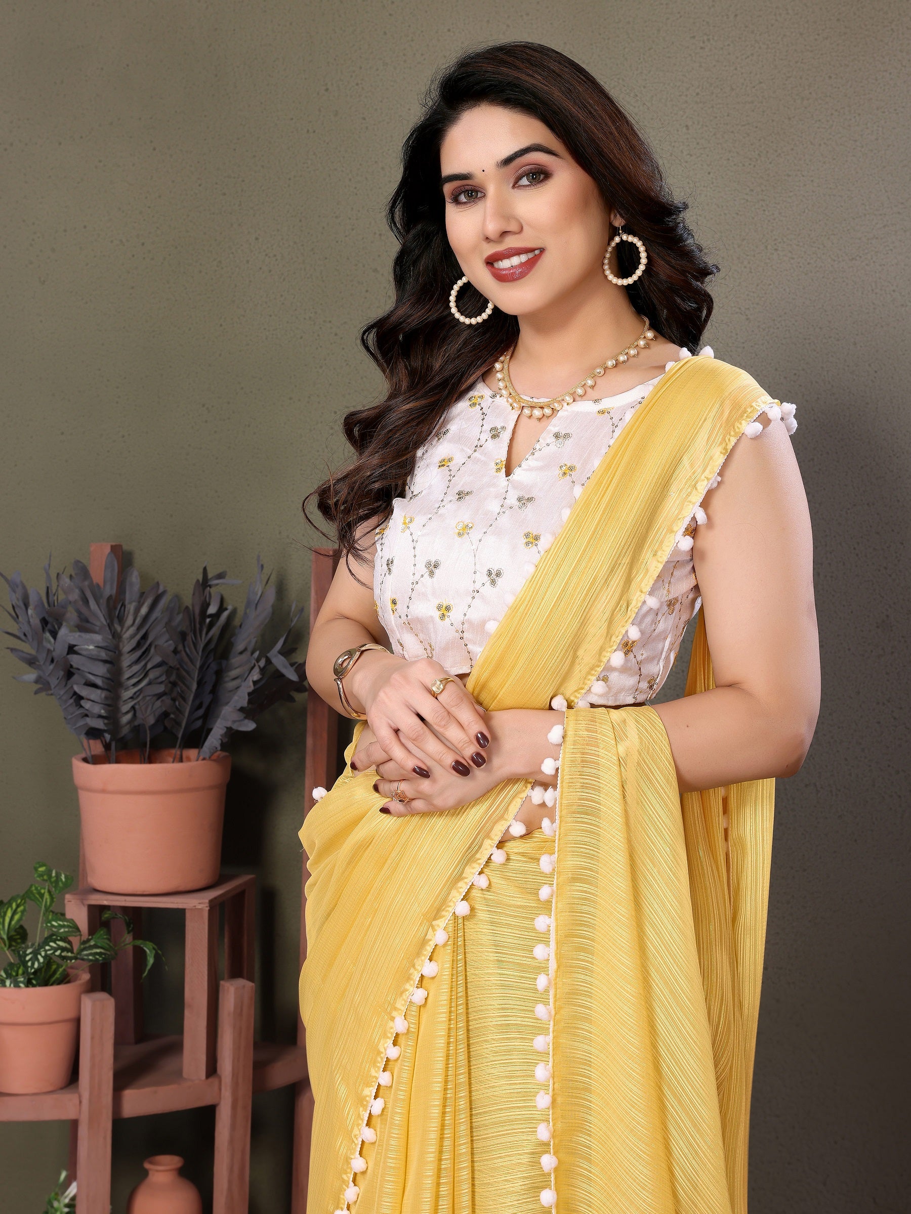 Sunny Yellow Pleated Saree with White Pom-Pom Border