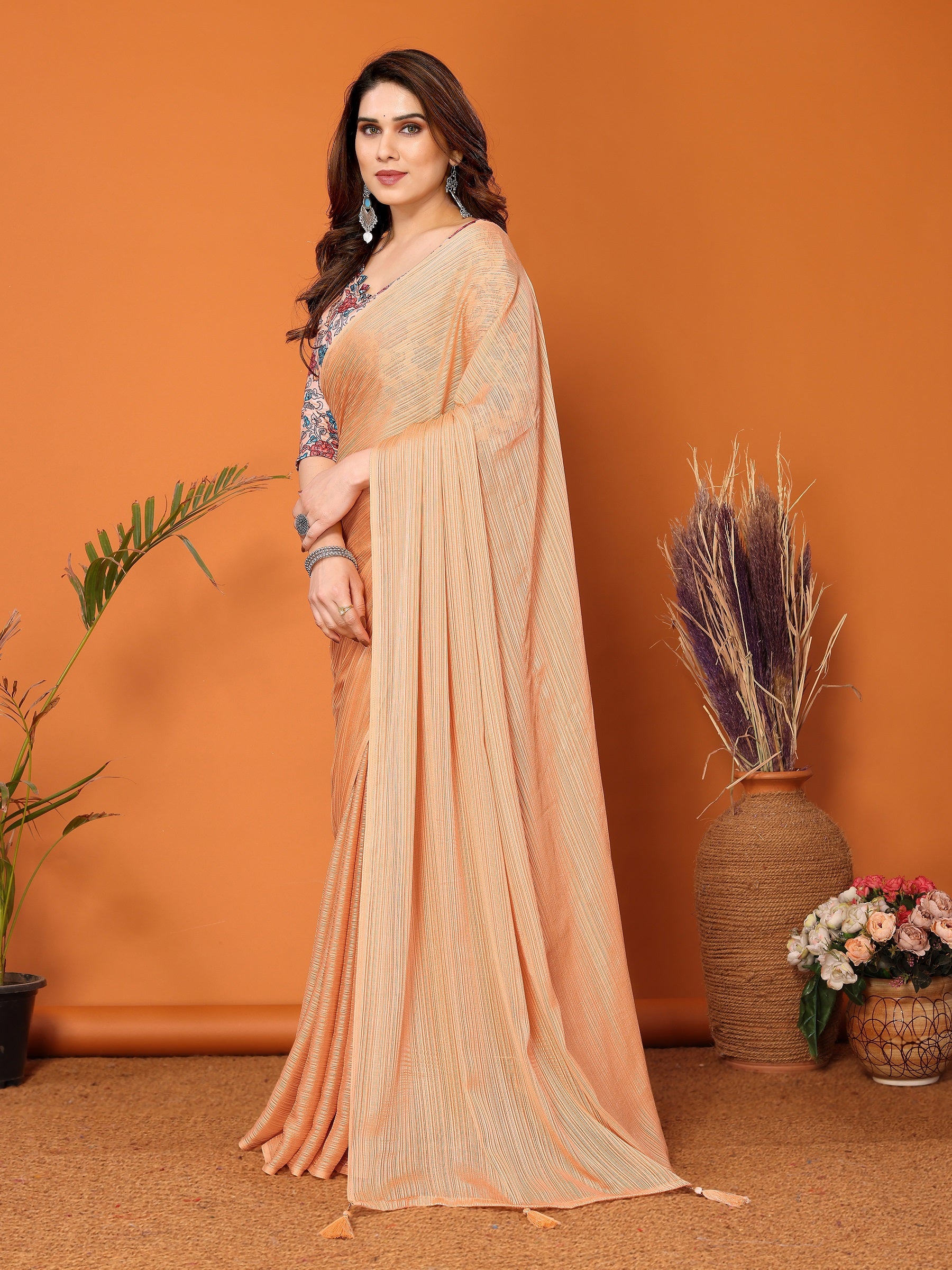 Elegant Peach Textured Saree with Floral Embroidered Blouse