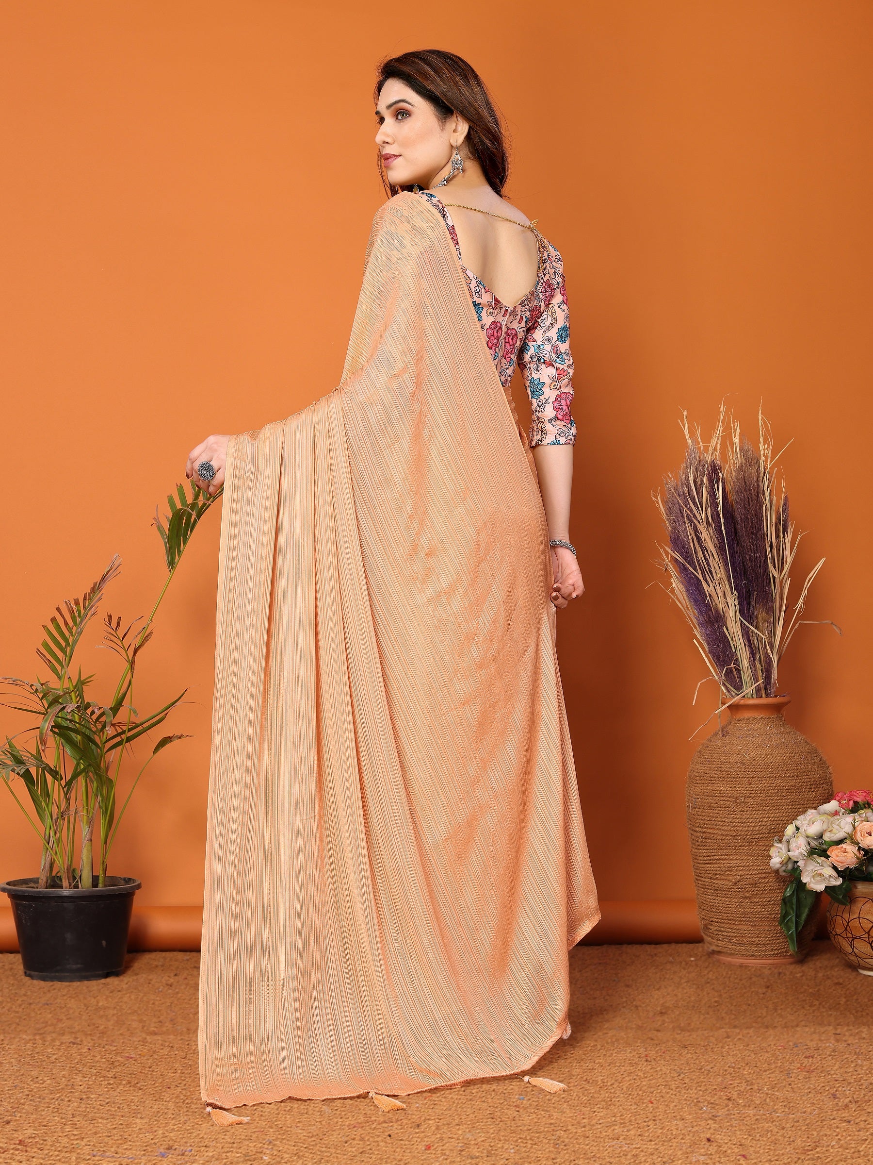 Elegant Peach Textured Saree with Floral Embroidered Blouse