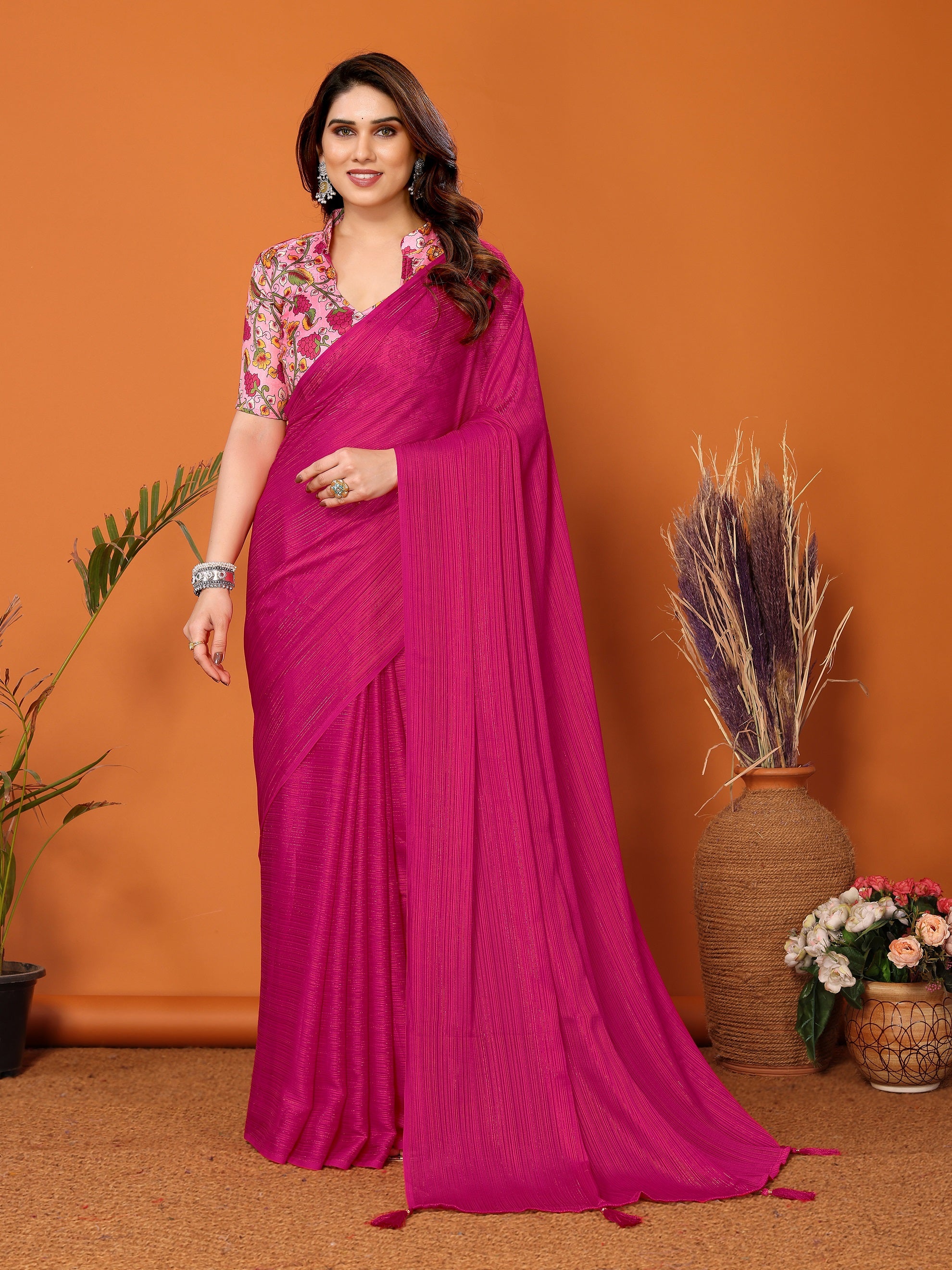 Vibrant Magenta Textured Saree with Colorful Embroidered Blouse