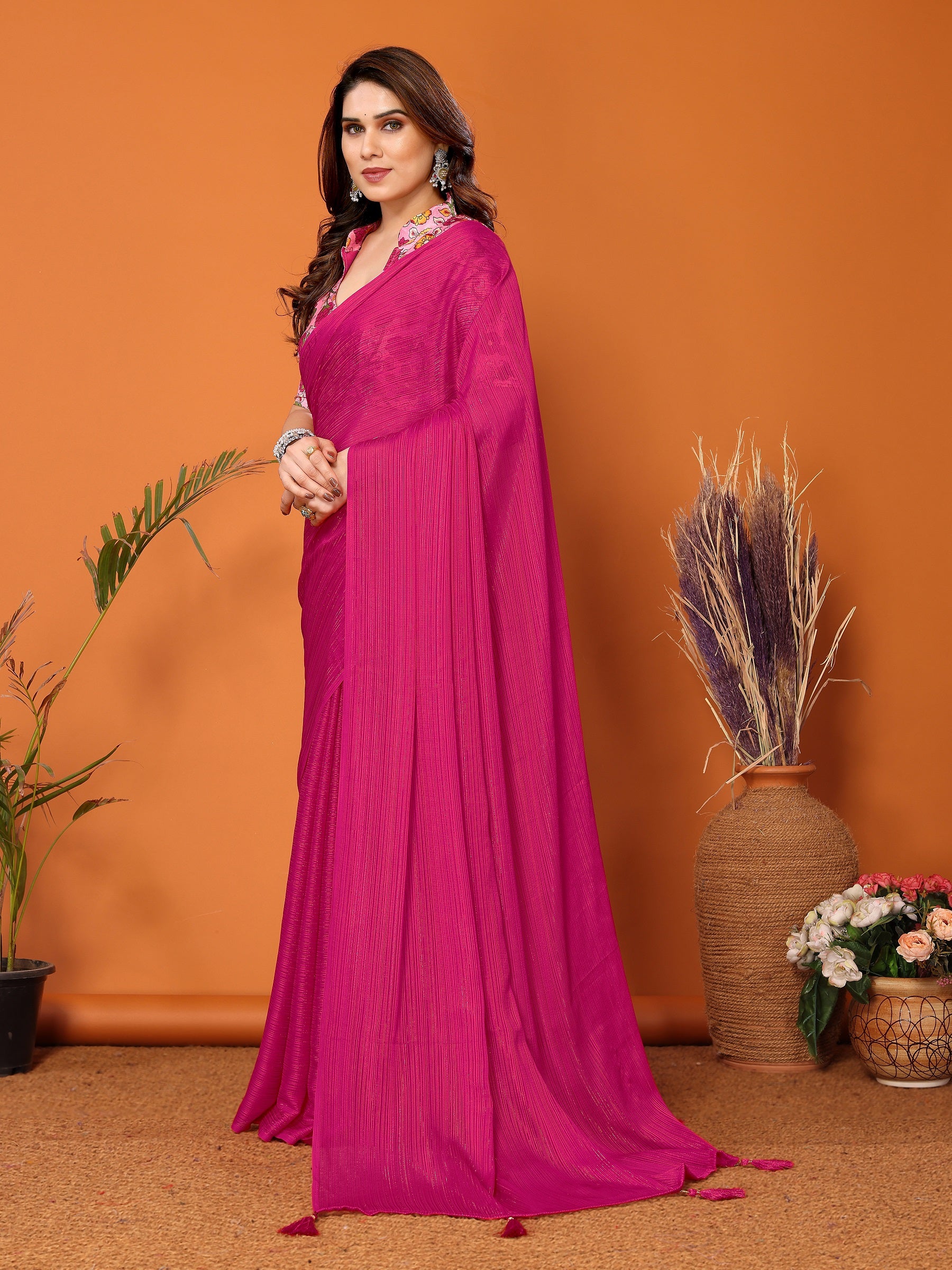 Vibrant Magenta Textured Saree with Colorful Embroidered Blouse