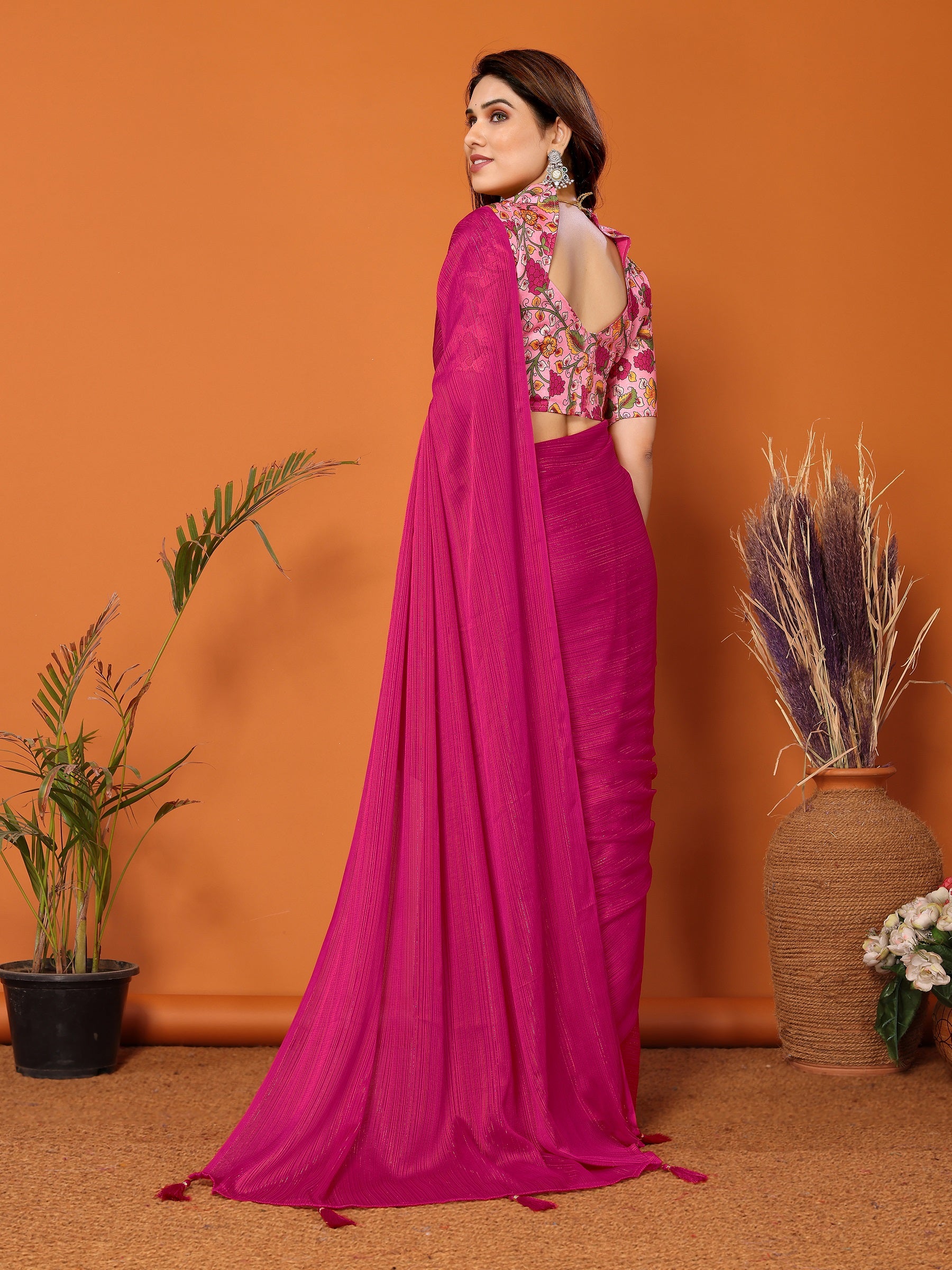 Vibrant Magenta Textured Saree with Colorful Embroidered Blouse