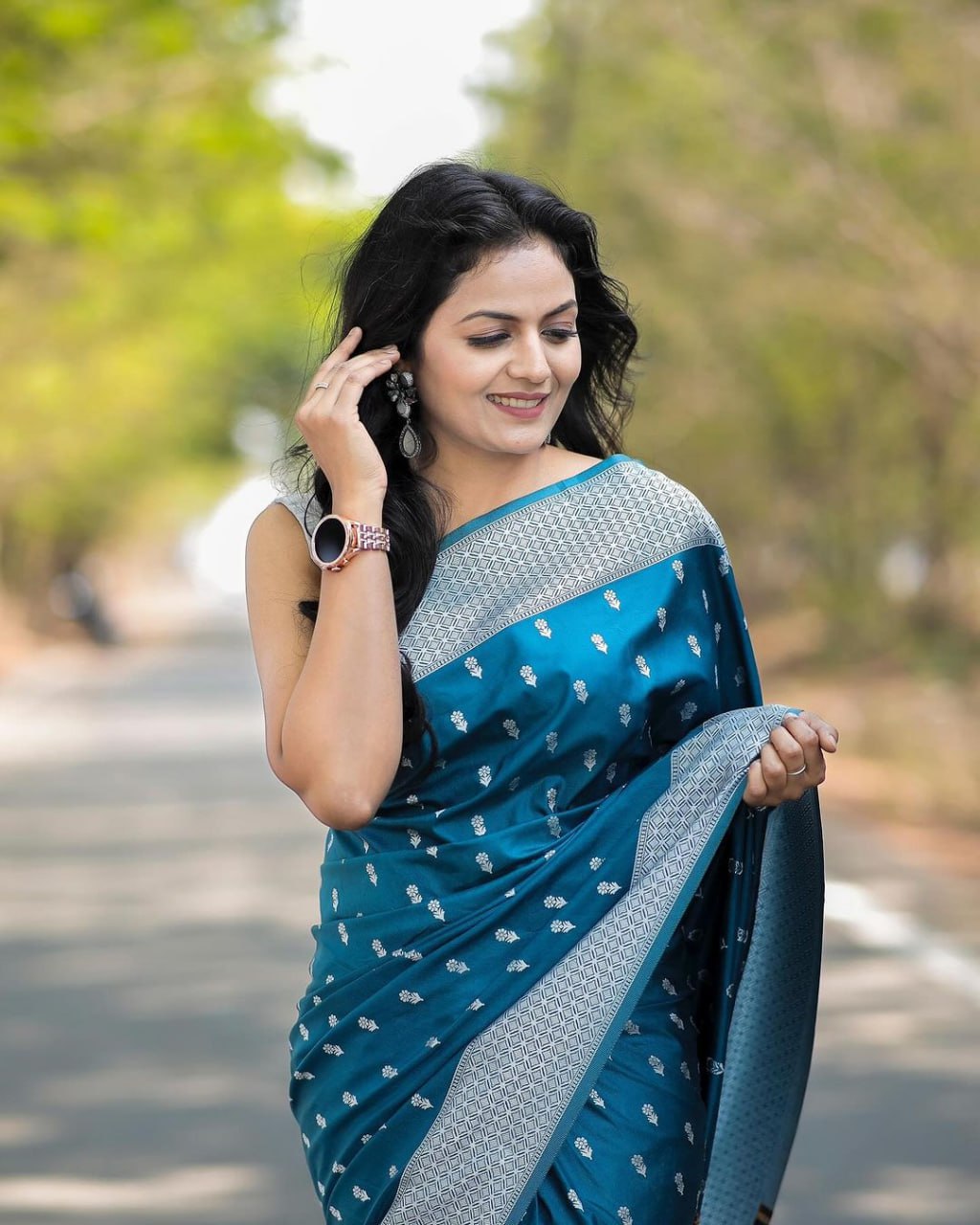 Teal Blue Woven Symphony Saree